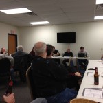 The meeting. The secretary seems a bit distracted...